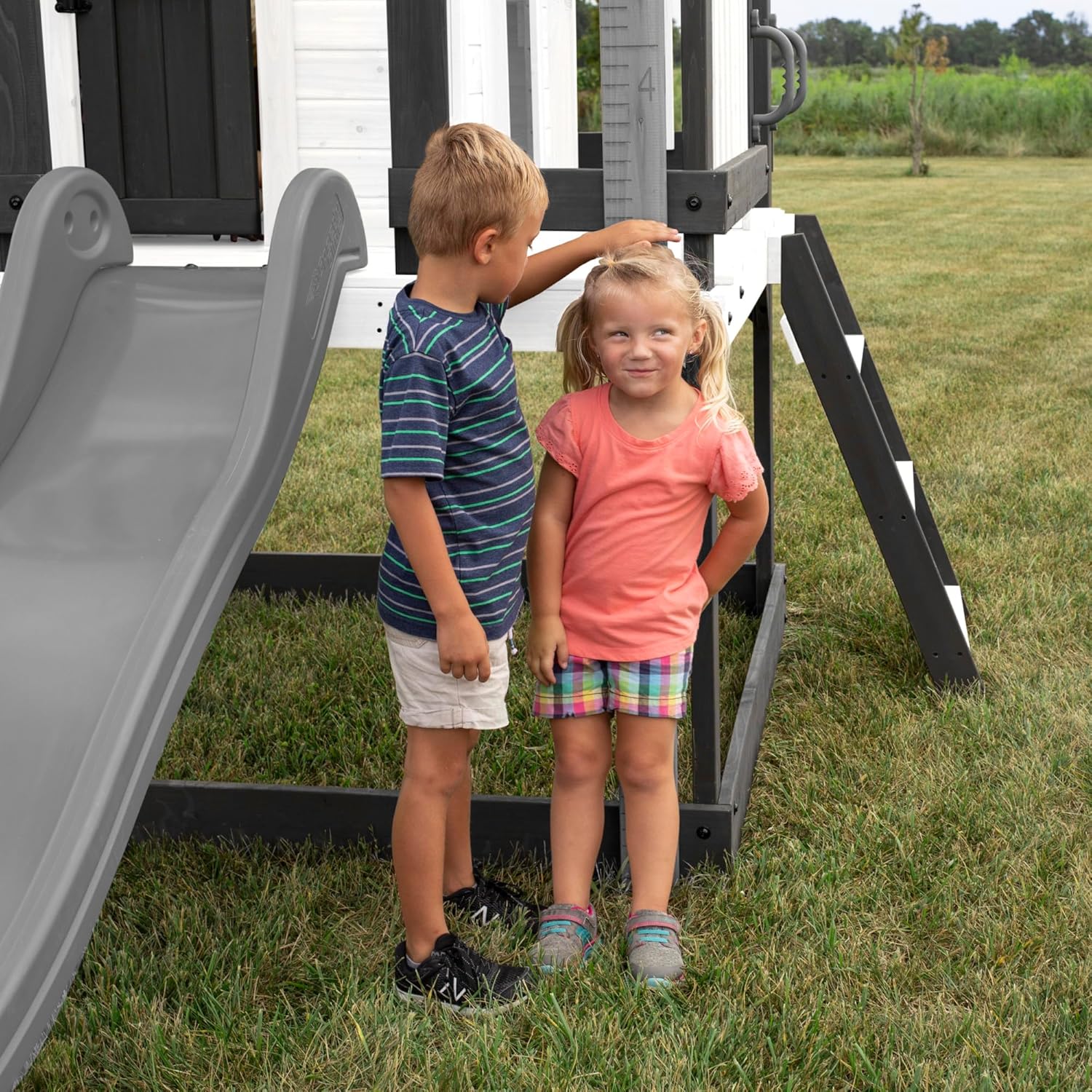 Backyard Discovery Sweetwater Heights White Elevated Cedar Wooden Kids Playhouse with Wave Slide, Play Kitchen, Step Ladder, Half Door, Wrap-Around Deck, Windows, Bell, Growth Chart for Outdoor Play B0C9JY7FV1 - Image 8